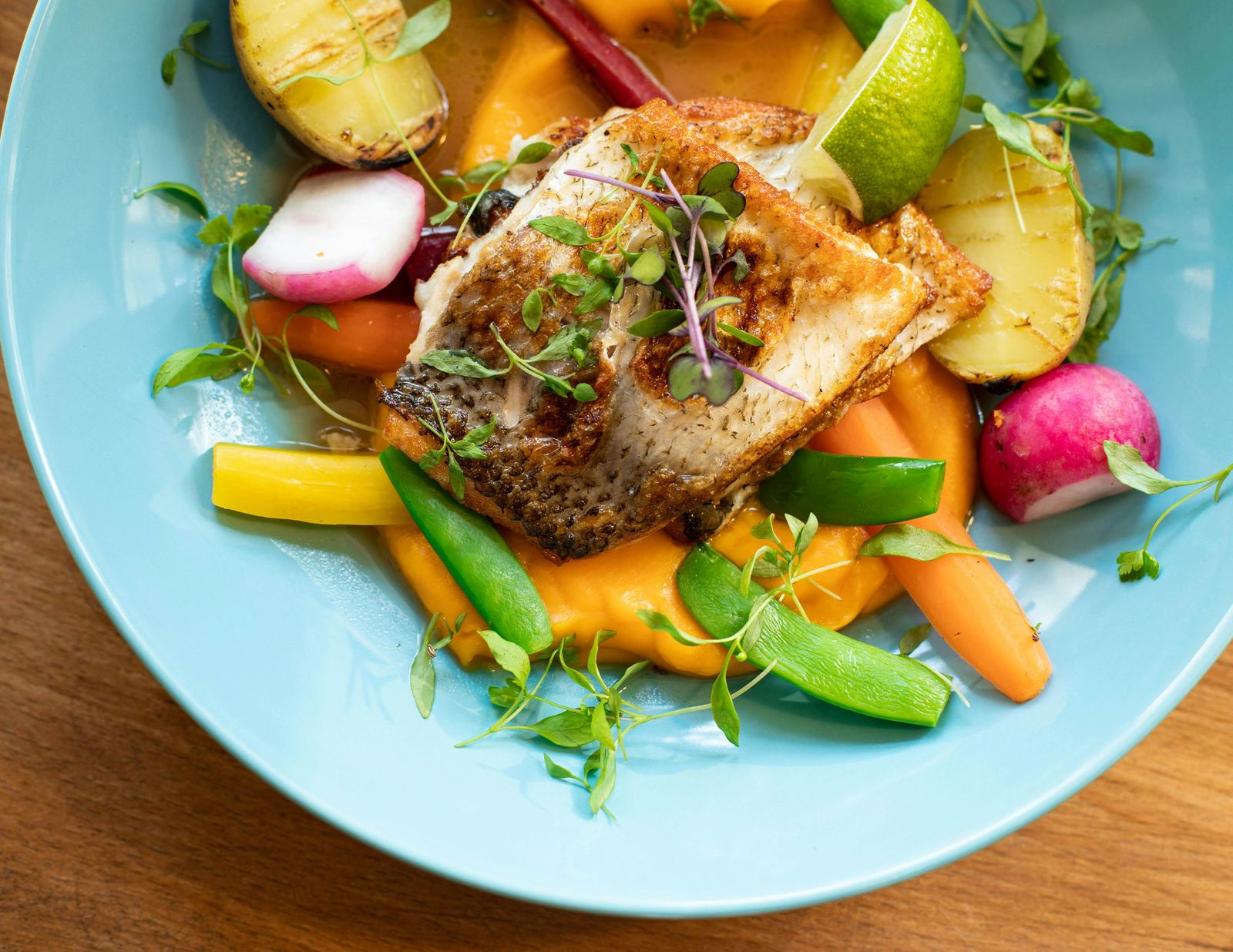 Pan-seared fish with colourful vegetables — rich in iron and omega-3s for period recovery